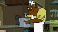 Chef Hatchet holding a pot of soup in the opening.