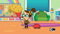 Beth uses a vacuum cleaner to get rid of the bees.