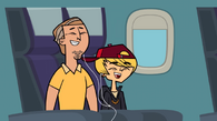 Dwayne and Junior enjoy their time on the plane, watching an episode of Total Drama: Pahkitew Island.