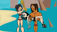 Heather snatches the golden chains from Alejandro.