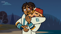 Wayne cries and hugs Raj as the latter rubs his back.