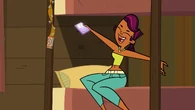 Sierra excitedly posts on her blog with her phone.