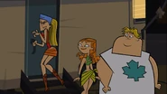 …and tries to go into the girl's trailer, but it is locked and she falls down after hitting the door.