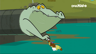 The giant alligator gets stuck in the pipe, moments before coughing up the boat.