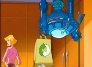 G.L.A.D.I.S. hands Jerry cleaning supplies.