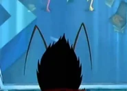 Max Exterminus watches the spies through a secret camera.