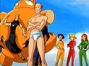 Jerry takes off his Feng Shui robe as Yin-Yang is taken away.