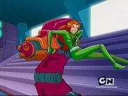 Sam pushing the giant video game gun.