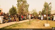 A crowd gathering along the Tigris in Iraq to watch an IS stoning