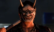 Shishido wearing a Hannya mask