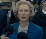 Thatcher speaking with the press