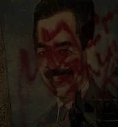 A defaced portrait of Saddam