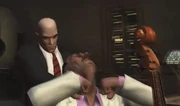 Delgado is garroted to death by .