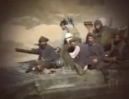 Northern Alliance fighters on a tank.