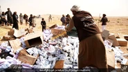 An IS fighter burning cigarettes in Homs, Syria