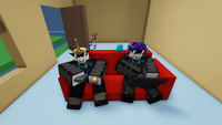 uwuPyxl and ObrenTune gaming on the loveseat.