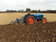 Les Wharton on one of the earlier tractors in the ploughing field