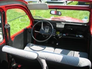 An 80s 2CV6 Special, interior from the back with the roof rolled open