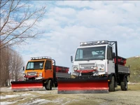 Turkar trucks fitted with ploughs