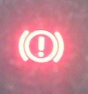 Brake warning light. The light is turned on, indicating that the brake is engaged.