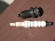 Spark plug insulator