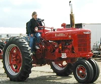 Farmall M (67 KB) restored McCormick Farmall M narrow front (dual front wheels) at EDGE & TA antique tractor show, Tulare, California, 2004
