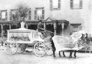 A horse-drawn hearse with driver, circa 1900. Courtesy Neil Regan Funeral Home