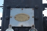 The polished serial number plate of 115100