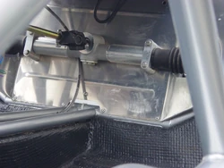 Rack and pinion unit mounted in the cockpit of an  sports car chassis