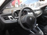 A modern road car's steering wheel ()