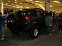 2005 blue Hummer H2 rear