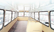 The interior of upper deck of a double-deck KMB training bus. All passenger seats have been removed.