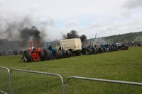 The tractor pullers warming up in the ring