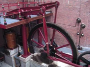 Beam engine, with twin connecting rods (almost vertical) between the horizontal beam and the flywheel cranks