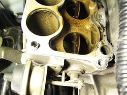 Lower intake manifold on a 1999 Mazda Miata , showing components of a variable length intake system.