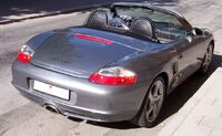 Porsche Boxster c. 2004, with detachable clear plastic windblocker and a Z-fold top, automatically raisable in 12 seconds[4] and optional 51 lb (23 kg) detachable aluminum hardtop (not shown)