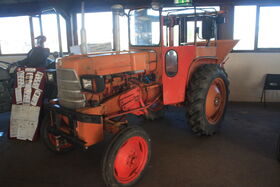 Allis-Chalmers fitted with cab and a vicon fertiliser spreader