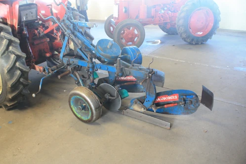 A Ransomes 2 furrow match plough on an International 444