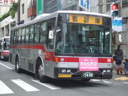 Standard route bus operating for training bus in Tokyu Bus, Tokyo. Yellow sign in Japanese language lettered "Training Bus".