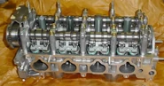 A double overhead camshaft (DOHC) cylinder head from a Honda K20Z3.