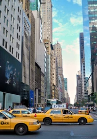Several New York City taxicabs during  rush hour in 