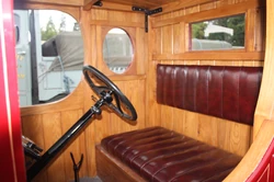 In side the timber cab(in) of early Ford truck