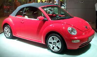 Volkswagen New Beetle c. 2008, with raised textile (cloth) convertible top featuring interior headliner, an acoustic insulation layer, and heatable glass rear window