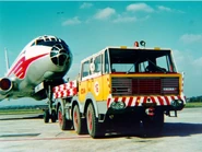 Airport tug T813 6x6 with Tu-104