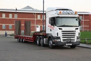  6x2 with a Tri-axle  machinery trailer