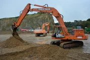 A 1980s Priestman Mustang 120 and Mustang 220 Excavators