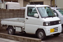 A sixth generation Minicab pickup truck.