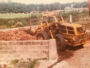 A 1970s Weatherill L61 4WD Loader Diesel working in a farm