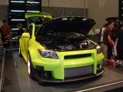 2005 yellow custom Scion tC front