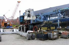 A pair of Jones wheeled cranes working in a shipyard